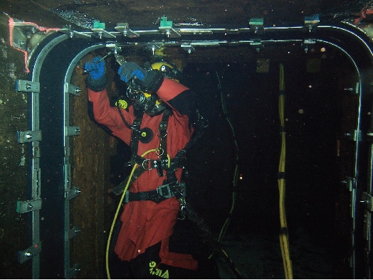HydraTite being installed underwater by a field services technician