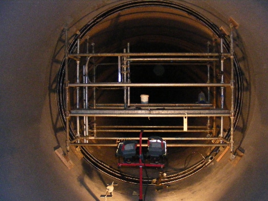 HydraTite Being installed in a lareg diameter Pipe with scaffolding