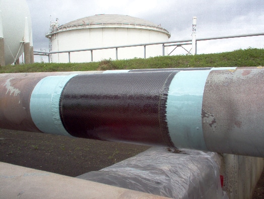 HyrdaWrap applied to multiple pipes for protection