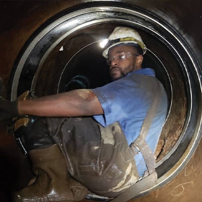 HydraTech Technician installing HydraTite in a small diameter pipe