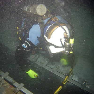 a diver installing a hydratite seal in an underwater box culvert