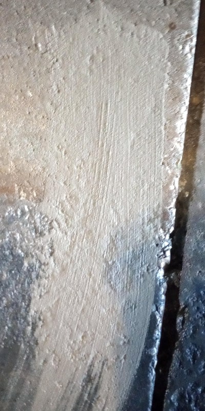 A patch of concrete used to smooth out the surface of a pipe for the installation of the HydraTite Internal Pipe Joint Seal
