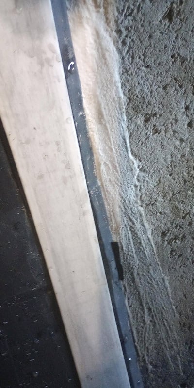 HydraTite installed over a joint that has a patch of concrete next to it