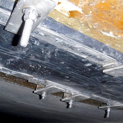 The dirty interior of a pipe in which the joint has been sealed with HydraTite