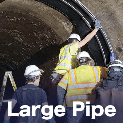 Several technicians installing a large HydraTite seal, 'Large Pipe'