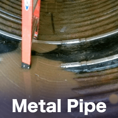 The invert of a corrugated metal pipe in which the joint has been reinforced with HydraTite, 'Metal Pipe'