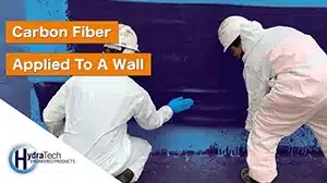 Technicians applying HydraWrap to a concrete wall