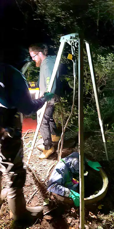 Joint with an active leak in a green PVC pipe