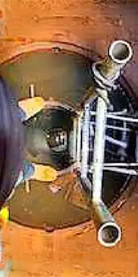 Looking-Down-Into-A-Pipe Two technicians installing HydraTite in a round pipe
