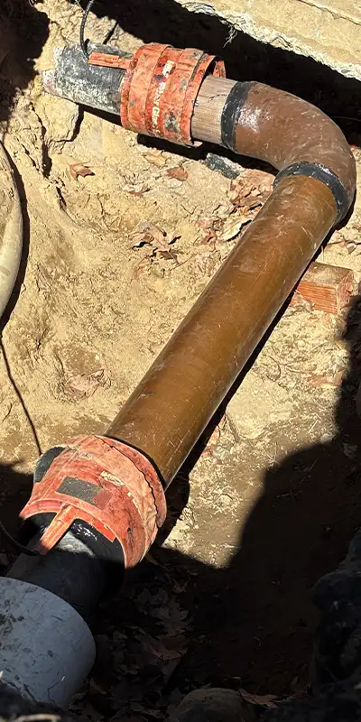 New concrete poured around the base of a pavilion post. A lower portion of the post has been reinforced with HydraWrap