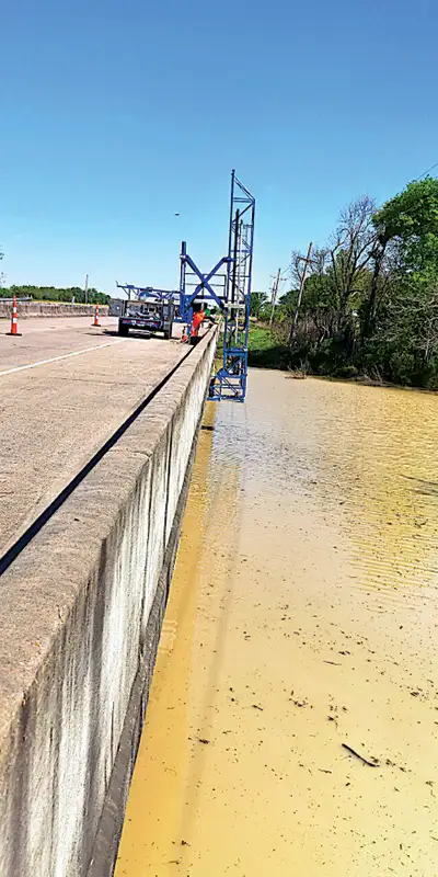 A-lift-being-used-to-repair-a-bridge Two HydraTite Installers