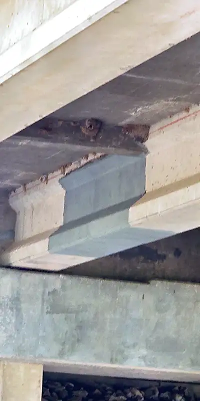 A-portion-of-a-bridges-support-wrapped-in-carbon-fiber Two HydraTite Installers