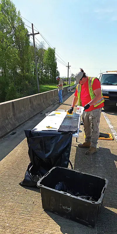 A-technician-working-epoxy-into-the-fibers-of-carbon-fabric Two HydraTite Installers