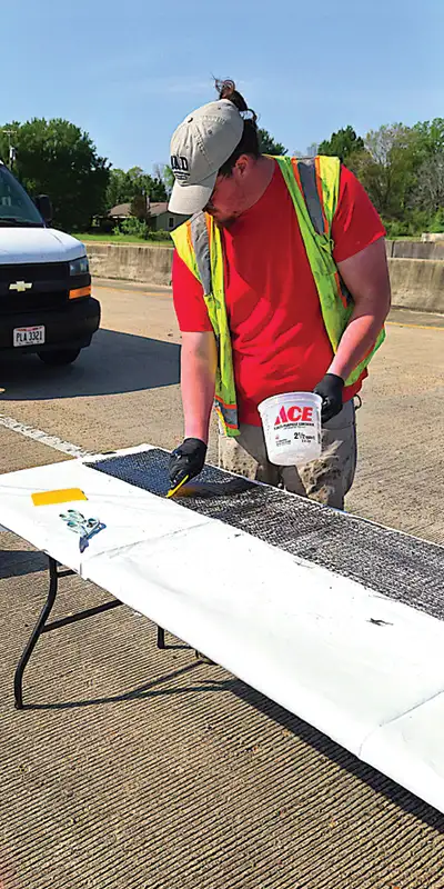 Appling-epoxy-to-carbon-fiber-fabric Two HydraTite Installers