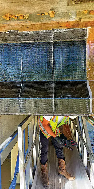 Carbon-fiber-fabric-applied-to-a-bridges-support Two HydraTite Installers