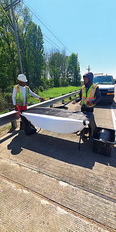 Measuring-out-the-carbon-fiber-fabric Two HydraTite Installers