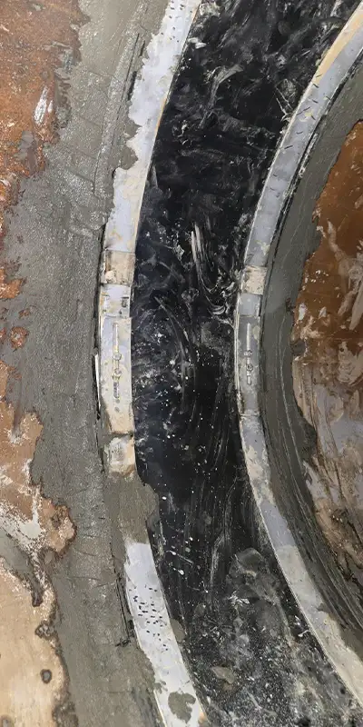 HydraTite Installed Over A Joint With Concrete Applied To The Edges Of The Seal4 Retaining bands loosely placed over a rubber seal