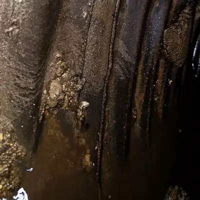 Retaining bands sitting at the invert of a pipe near the joints