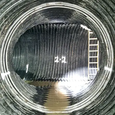 Retaining bands sitting at the invert of a pipe near the joints