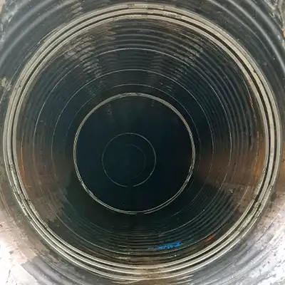 Retaining bands sitting at the invert of a pipe near the joints