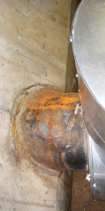 New concrete poured around the base of a pavilion post. A lower portion of the post has been reinforced with HydraWrap