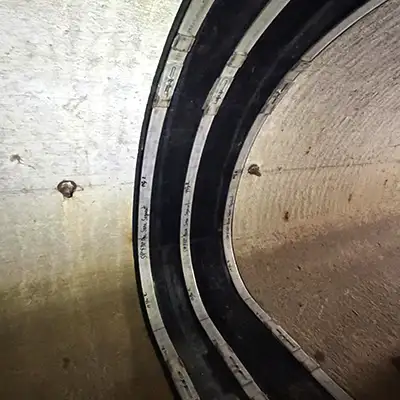 A HydraTite seal installed over a joint in an irregularly-shaped pipe