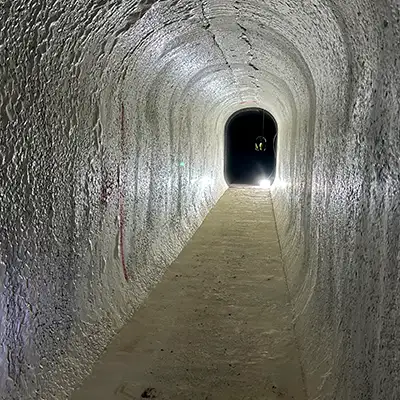 a long arched tunnel that functions as an aqueduct inside a bridge