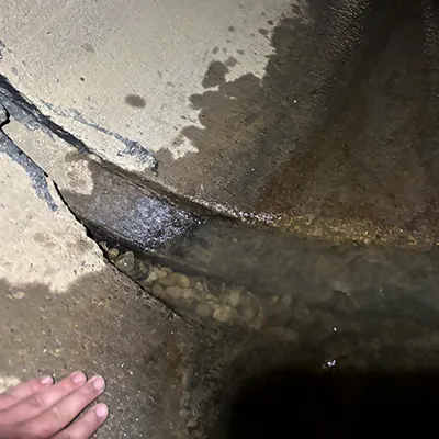 A severely separated joint in a reinforced concrete pipe