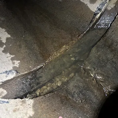 A severely separated joint in a reinforced concrete pipe
