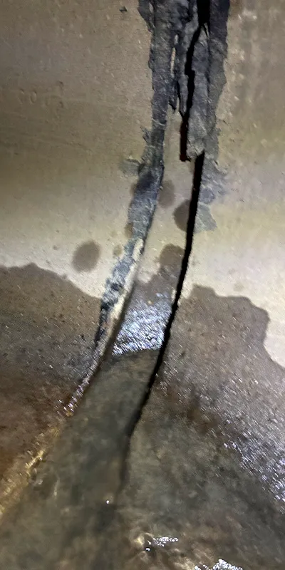 A severely separated joint in a reinforced concrete pipe