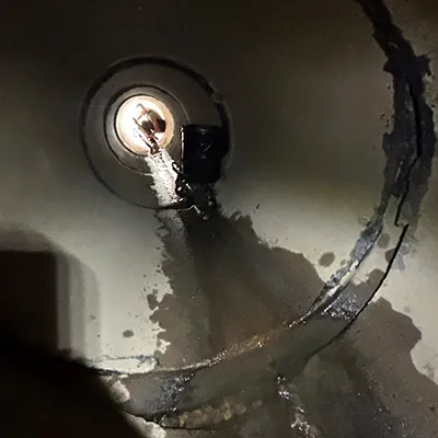A severely separated joint in a reinforced concrete pipe
