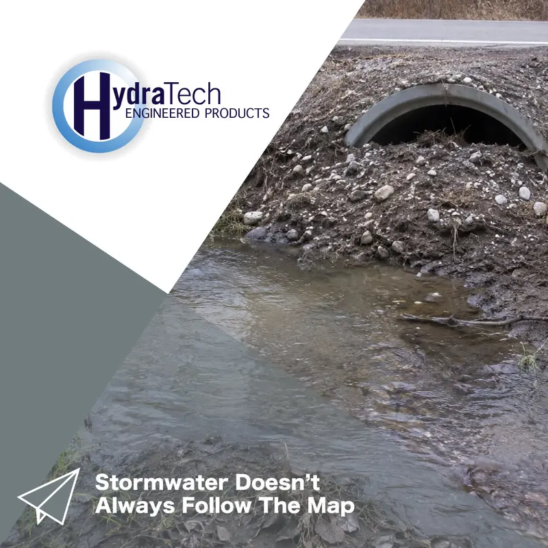 A debris covered culvert that has been blocked off with dirt and water is flowing by it not in it1 Water not going into a stormwater culvert due to debris build up at the mouth of the pipe