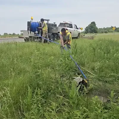 HydraTech Crew Using A Jetter Vac To Clean Out A Culvert A few field service members pumping out a culvert with a jetter vac