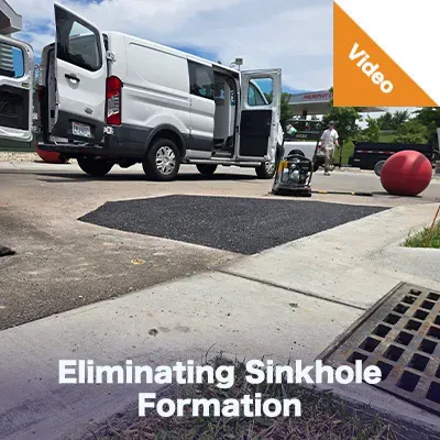 Sinkhole Repair And Prevention Case Study Teaser A culvert under a roadway with its invert paved. 'Field Culvert Paving'